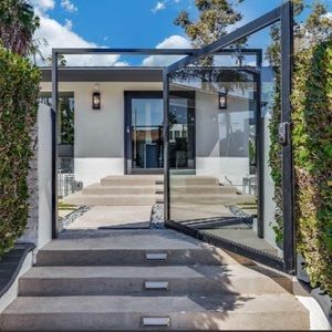Custom made Aluminum & glass pivot door with keyless entry. 72x80